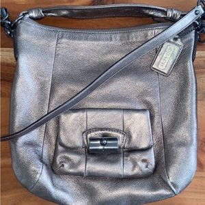 Small blemish as shown in photos, has a long and short strap